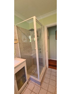 Corner-fully-framed-pivot-door-shower-screen